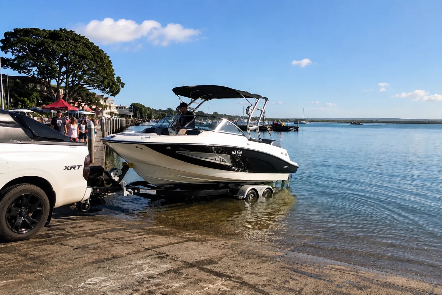 Boat and jetski on New Zealand water — marine finance before summer